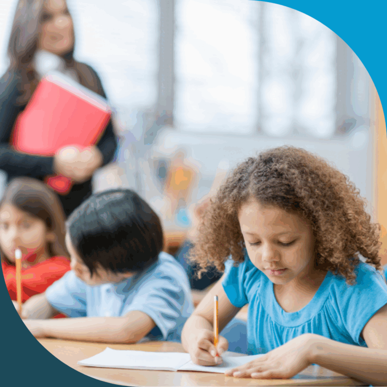 elementary girl student writing in classroom during teaching instruction